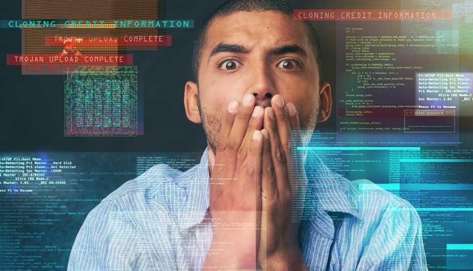 Hombre con las manos en la cara frente a una pantalla con datos