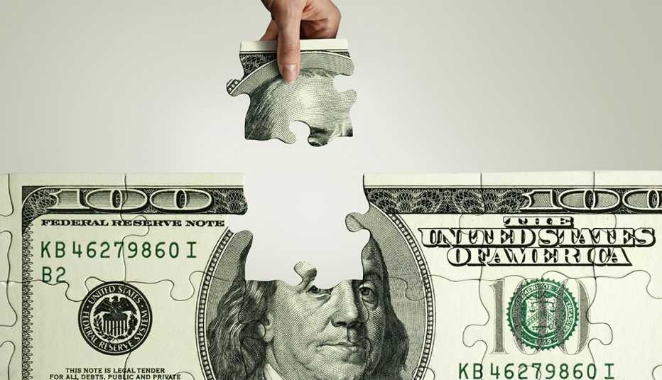 Rompecabezas de un billete de 100 dólares al que se le extrae una parte