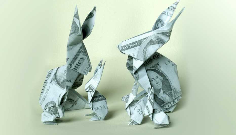 Figuras de conejos hechas con dólares - Inversiones en acciones DRIPs