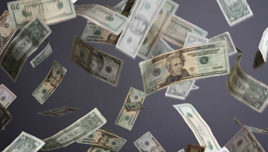 Billetes de dólar suspendidos en el aire