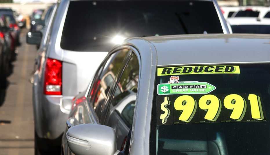 sticker price on the windshield of a used car for sale