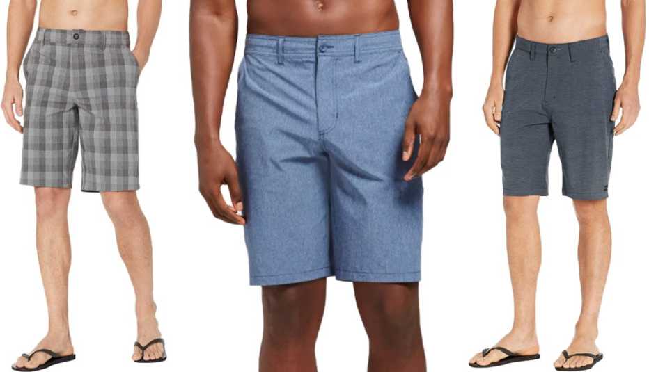 (De izquierda a derecha) Pantalones cortos híbridos para hombres, con tejido elástico, de O'Neill, de 21 pulgadas, de color asfalto; pantalones cortos híbridos para hombres, en talla grande y alto, de Goodfellow & Co., de 10.5 pulgadas, en azul; pantalones cortos híbridos clásicos para hombres, de Billabong, en azul marino.