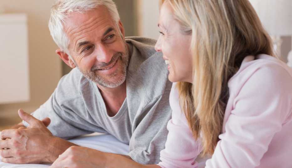 Maure Couple Talking On Their Bed In Their Bedroom, AARP Home And Family, Sex And Intimacy, Sex After Prostate Cancer