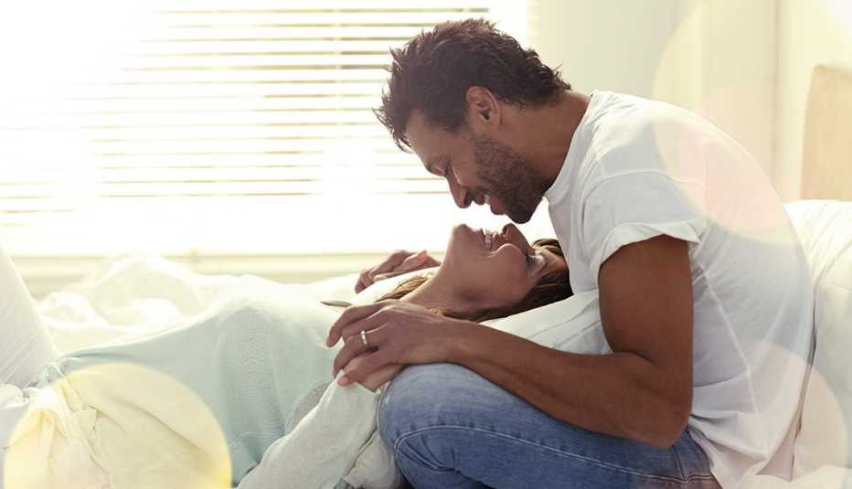 Hispanic Couple Kissing In Bed, AARP Home And Family, Sex And Intimacy, How To Kiss Better Hispanic Couple Kissing In Bed, AARP Home And Family, Sex And Intimacy, How To Kiss Better