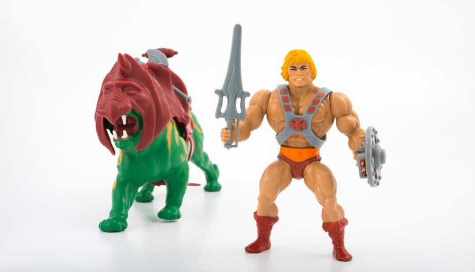 He-Man, una figura de mattel junto a su felino de batalla