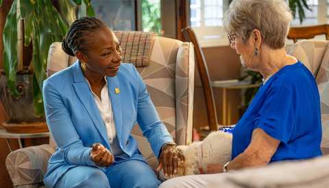 c e o doctor myechia minter-jordan stands with marylyn jones outside marylyn's home