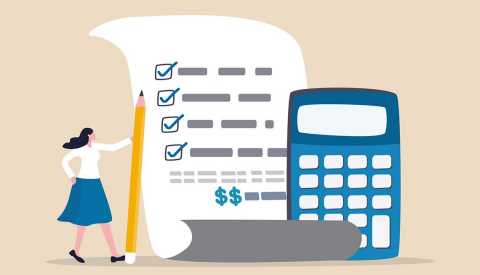 Social security calculator woman holding pencil next to a budget sheet and a calculator