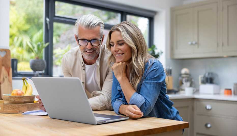 couple reviewing finances with the help of aarp retirement calculators