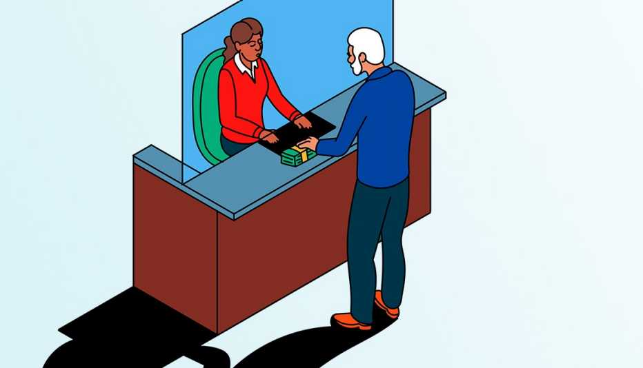una persona retira dinero de un banco