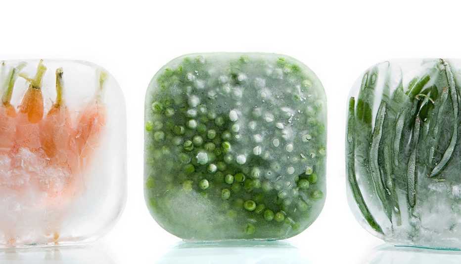 Frozen Carrots, Peas And Green Beans On A White Backgrond, AARP Home And Family, Your Home, 3 Ways To Preserve Food During A Power Outage