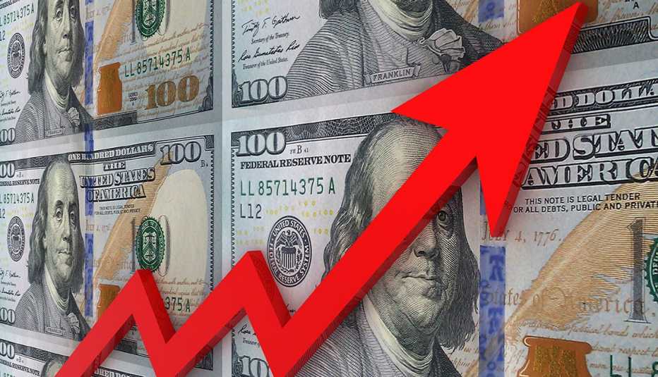 Flecha roja sobre unos billetes apuntando hacia arriba