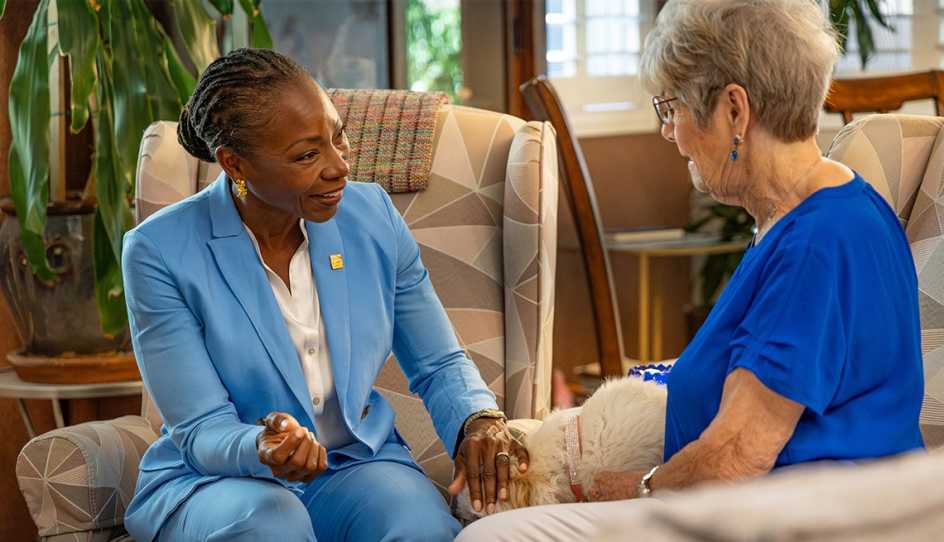 c e o doctor myechia minter-jordan stands with marylyn jones outside marylyn's home