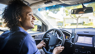 view from inside a car of a woman driving