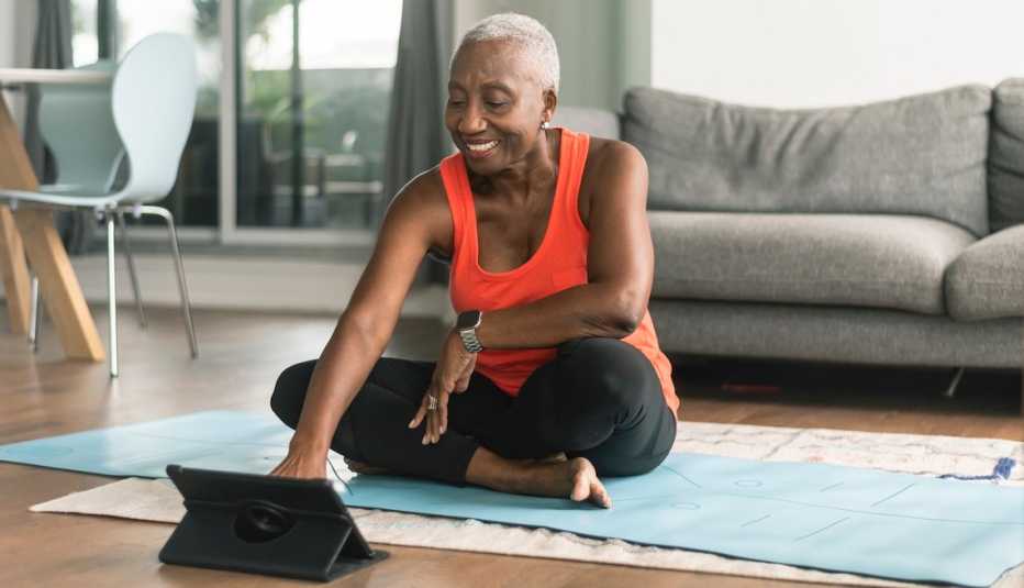 Woman taking online yoga class