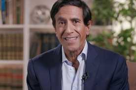 Sanjay Gupta, M.D. smiling in front of a bookshelf Sanjay Gupta, M.D. smiling in front of a bookshelf