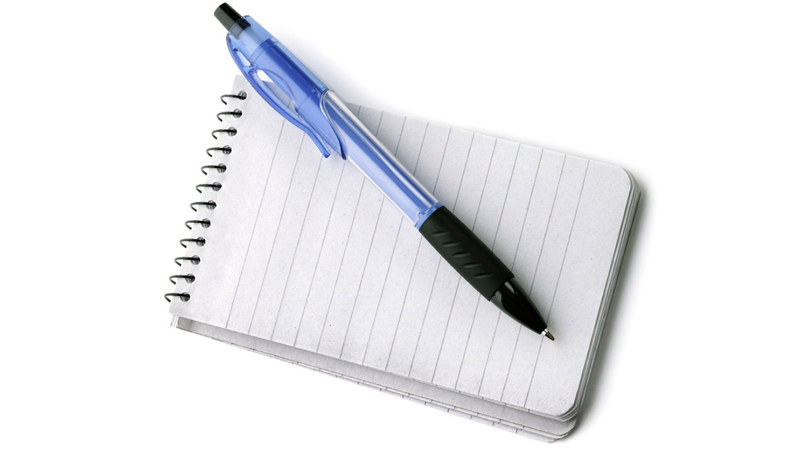 Travel Tips for People With Hearing Loss - Notebook and ballpoint pen