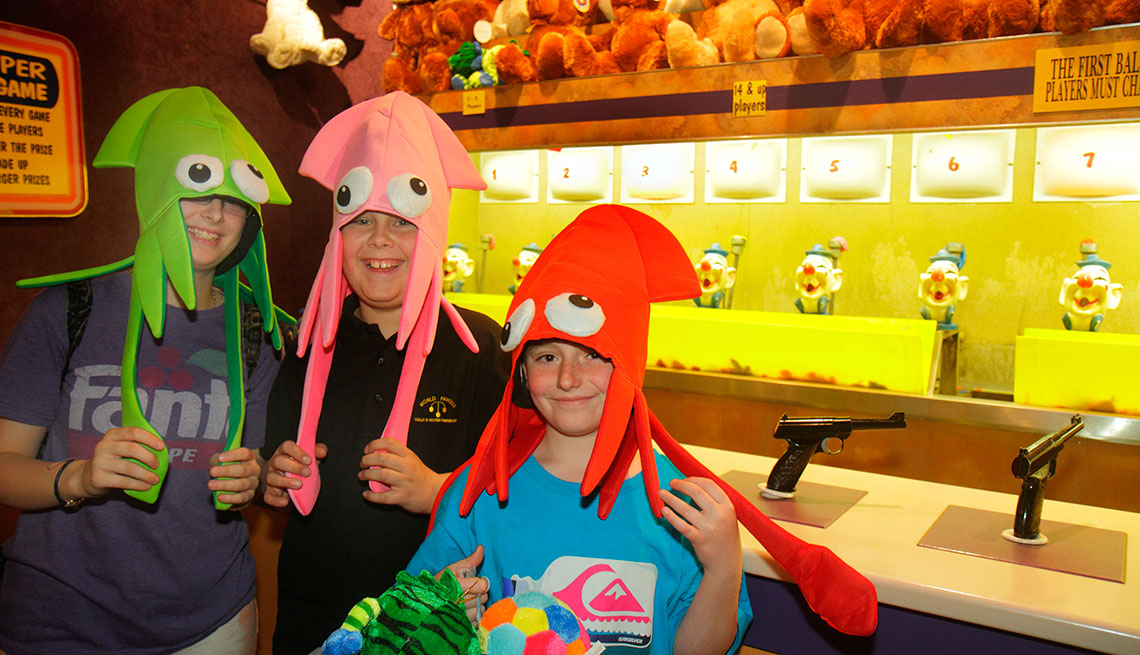 item 8 of Gallery image - Children wearing funny hats they have won on a carnival game at Circus Circus Hotel Casino.