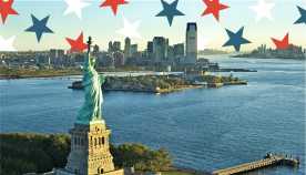 Statue of Liberty next to body of water; red, white and blue stars at top of photo