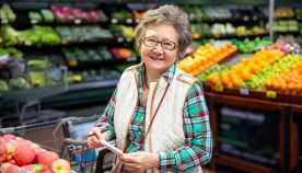 A woman in the supermarket produce isle