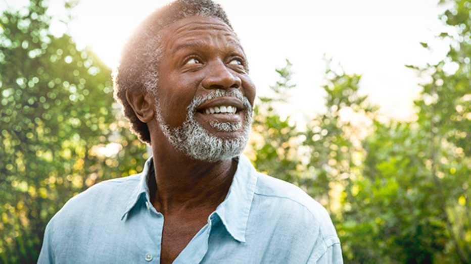 A man looking happy out in nature