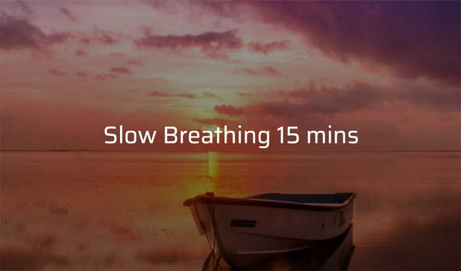 A small boat on calm water at sunset with the text "Slow Breathing 15 mins"