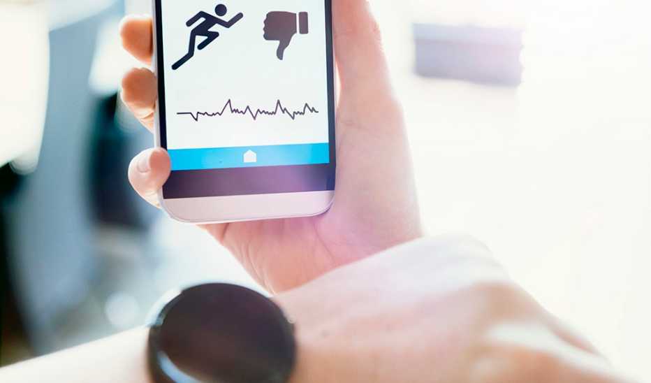 A smartwatch and mobile phone with an app tracking activity