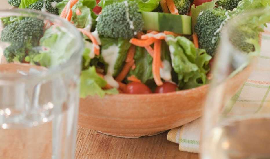 Glasses of water beside a bowl of salad
