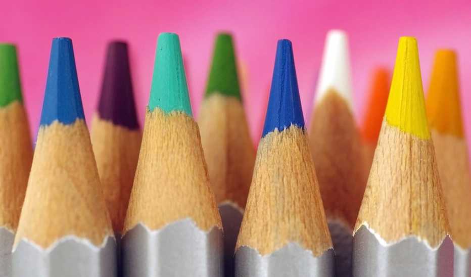 Multi-colored pencil points on vibrant background