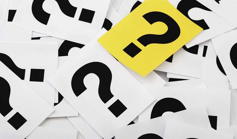 A yellow question mark with white question marks