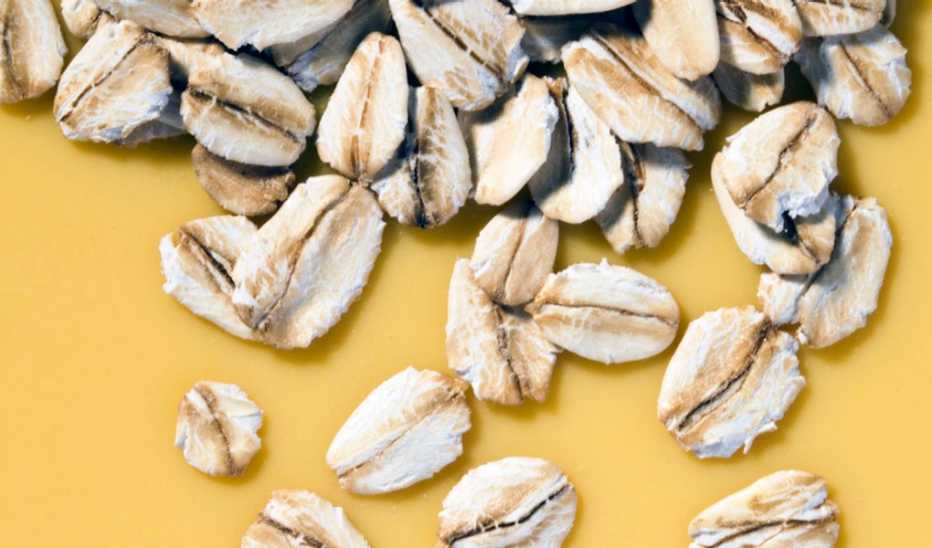 An up-close view of oats on a plain background