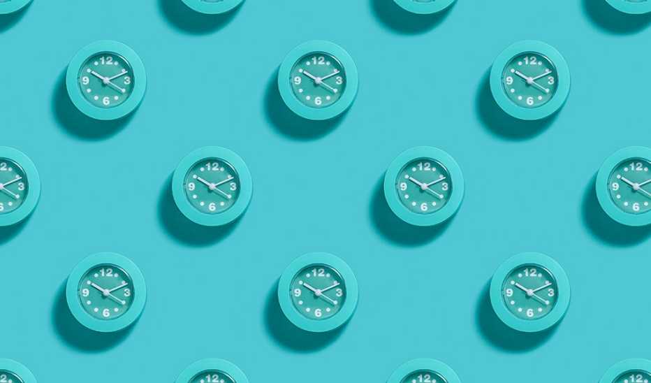 Illustration of multiple clocks on a blue background