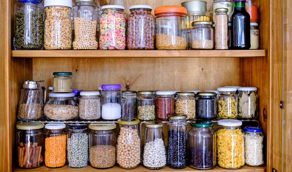 Jars of beans and lentils in a cabinet