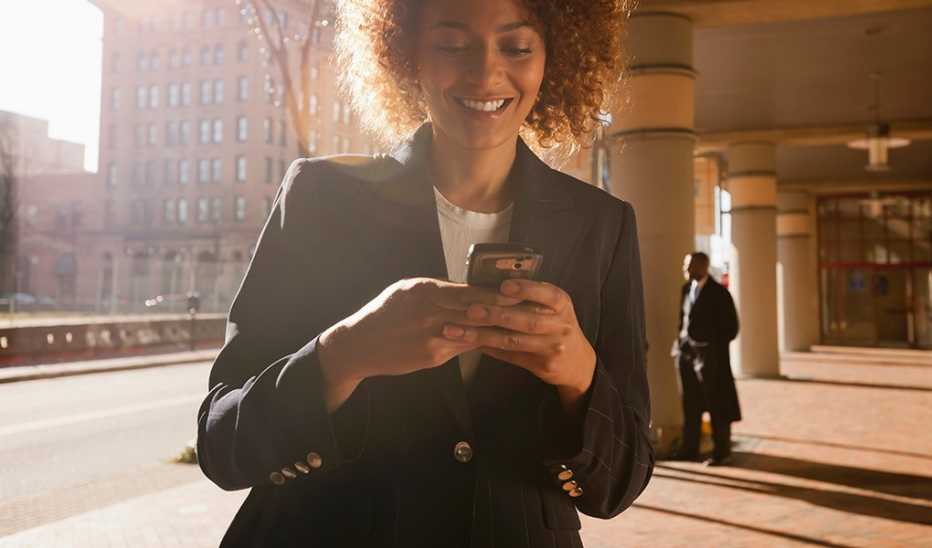 A woman texting on a cell phone