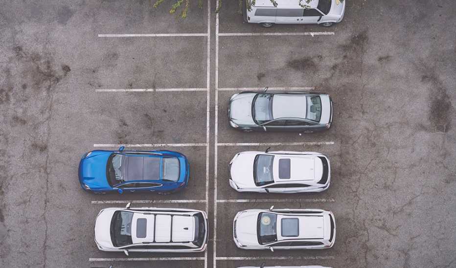 A high-angle view of cars parked in a parking lot