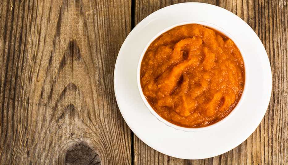 A close-up view of pumpkin puree in a bowl