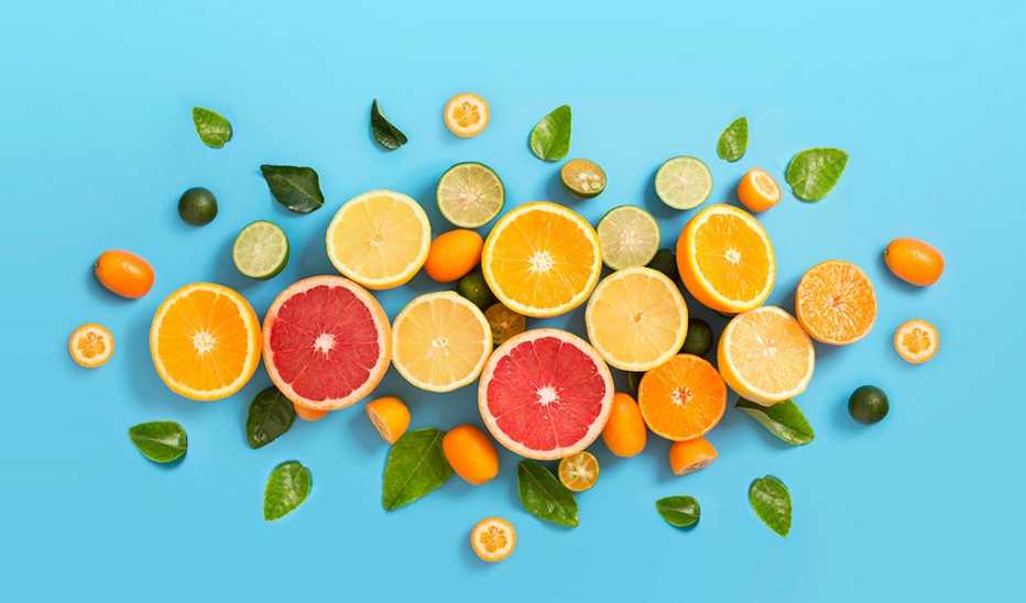 Various citrus fruits on a blue background