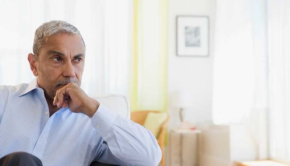 A man sitting in a home and thinking