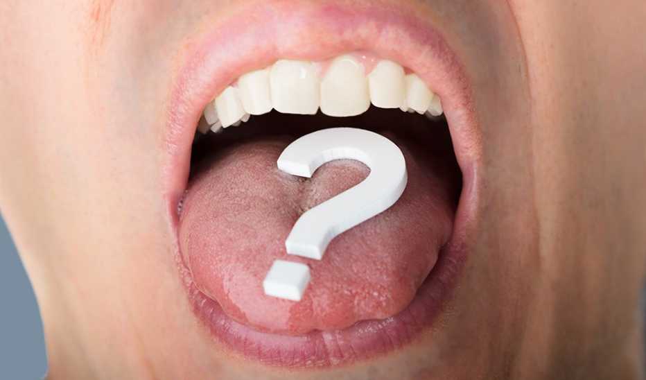 A question mark on a person's tongue