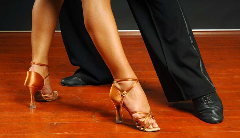 A close-up view of the feet of both a male and female Latin dancer
