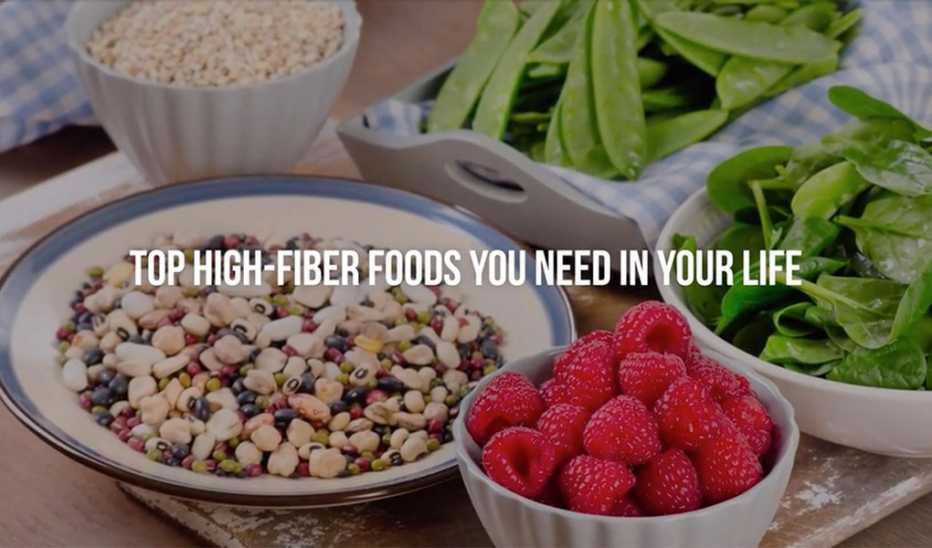 A close-up view of high-fiber foods on a table with the text "top high-fiber foods you need in your life"