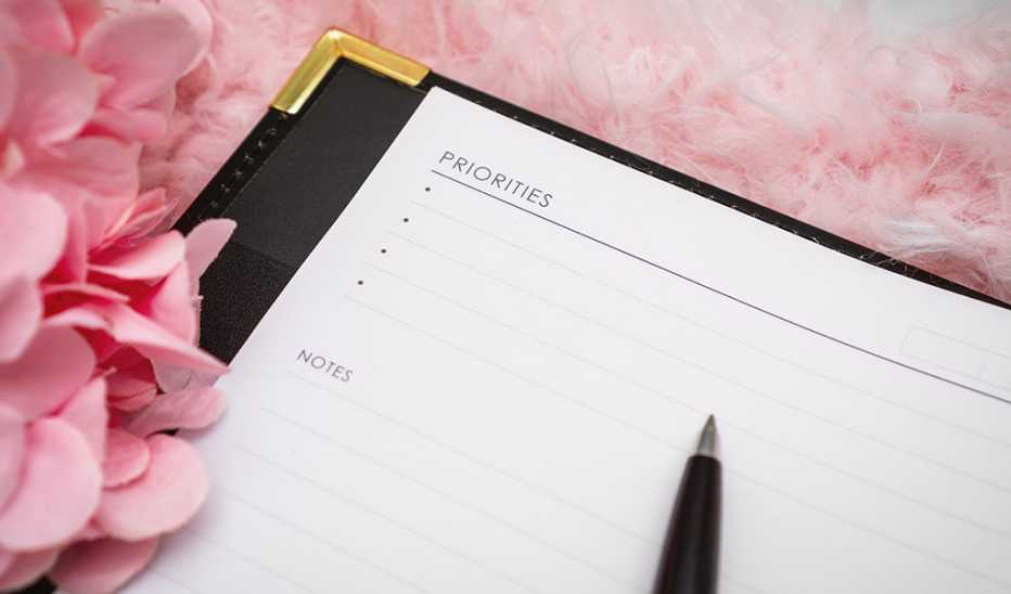 A close-up view of a personal organizer pad to list priorities and notes