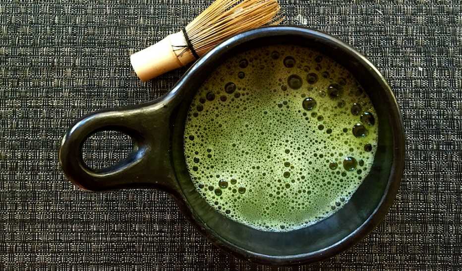 An up-close view of a cup of green tea