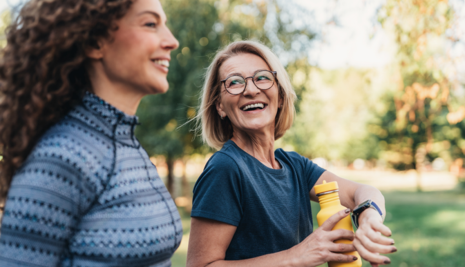 Two women enjoying an outdoor workout together in a park