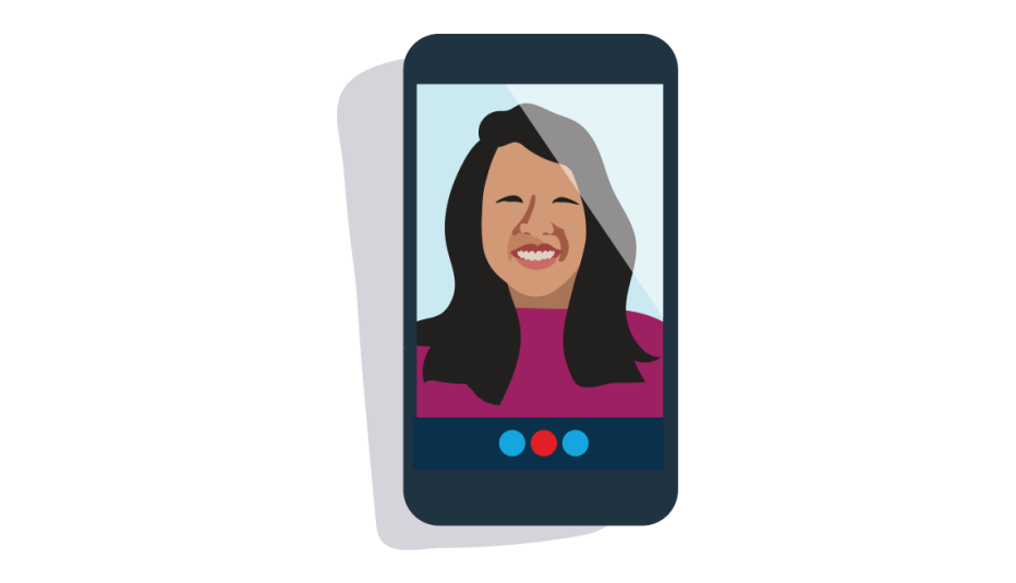 A smiling woman on the screen during a mobile phone video chat
