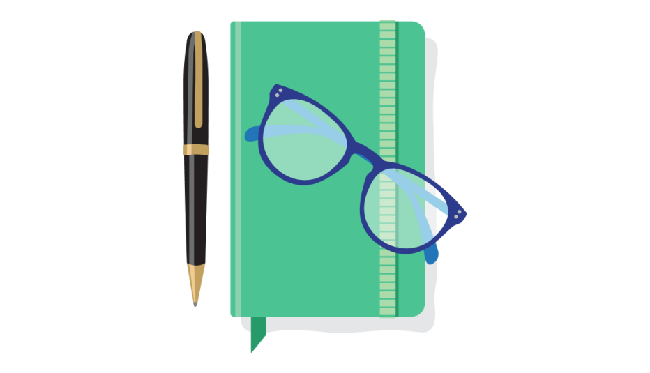 A green notebook with blue glasses on top and a black pen beside it