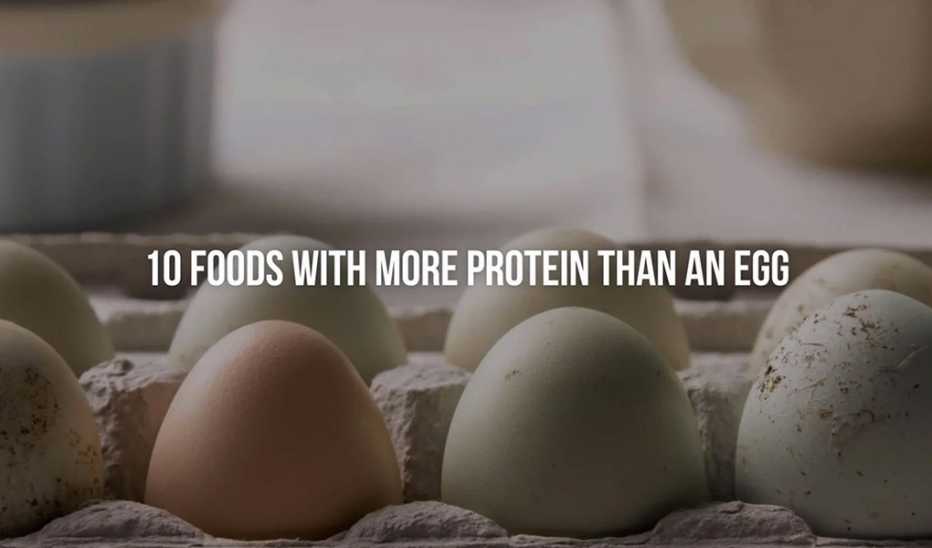 A close-up view of eggs in a carton with the text "10 foods with more protein than an egg"
