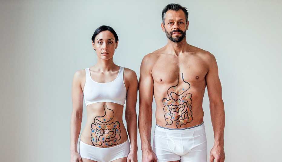 A man and woman with illustrations of their intestines with colorful bacteria on their stomachs