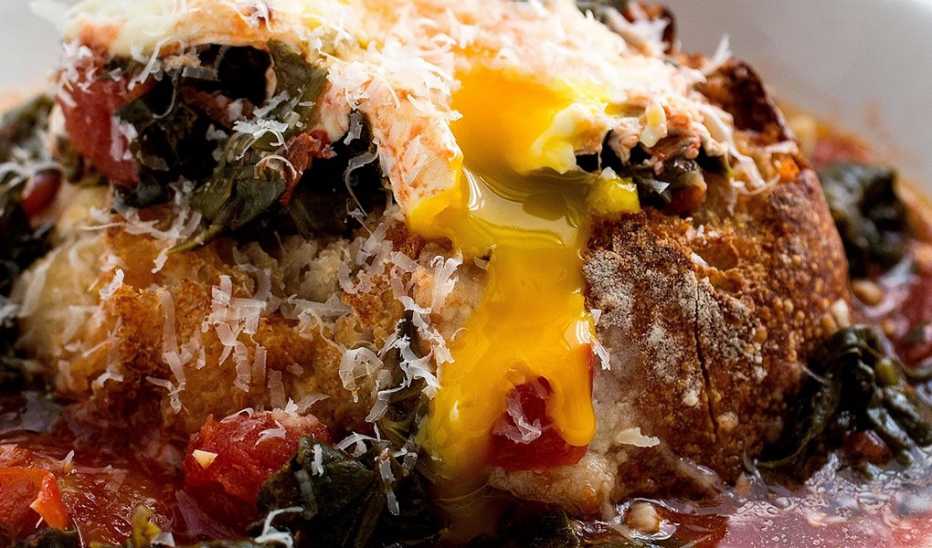 A close-up view of bread and tomato soup