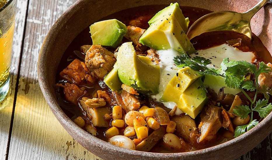A close-up view of chicken chili with sweet potatoes in a bowl