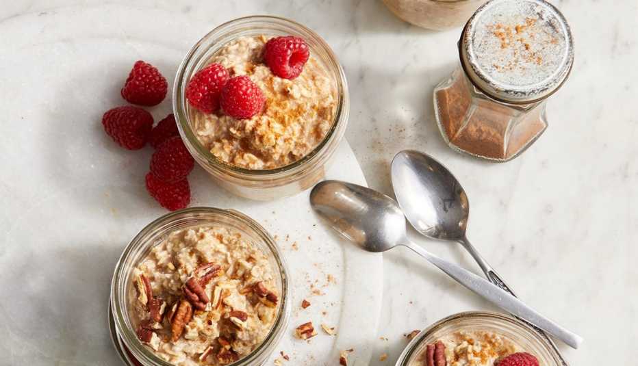 A close-up view of cinnamon roll overnight oats in jars